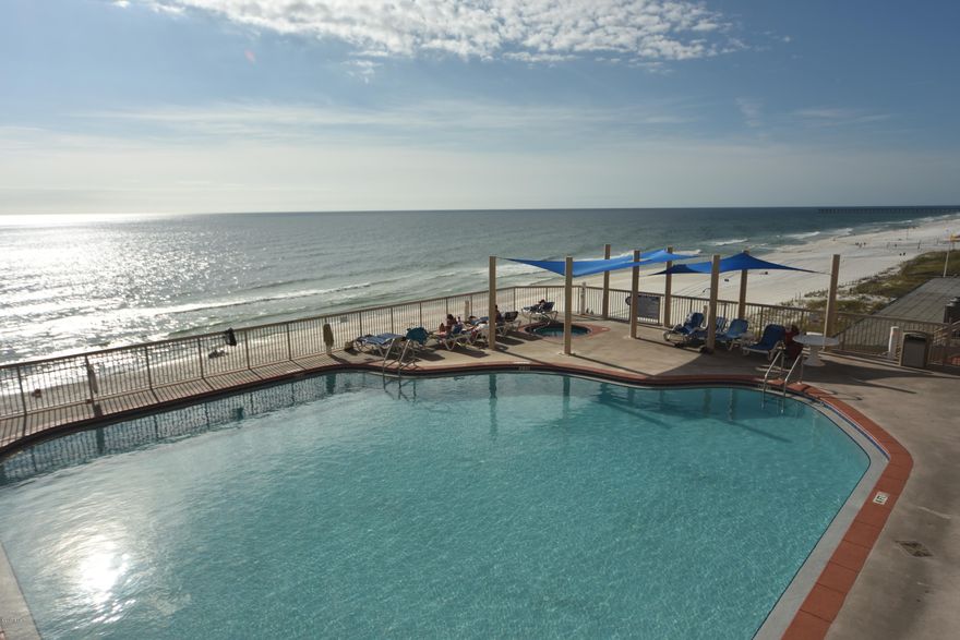 As they say in real estate - location, location, location and Unit 608 at Sunrise Beach has it! Pier Park and all it's amenities are only a mile away and with over 350ft of gorgeous white sand and emerald waters this complex is ideal and turnkey. The unit has new wood-look tile throughout, new paint throughout, new living room & dining furniture, new flat screen TV's, new central heat pump/AC system in 2016 with digital, flat screen WiFi thermostat that can be operated remotely, new dishwasher, and new dryer. The unit is a spacious 2 bedroom, 2 bath with a bunk room - not a hallway and features tall ceilings, granite kitchen counters & oak cabinetry, the master bedroom is gulf front and has balcony access. The master bath has double sinks, separate soaker tub and walk-in shower. The complex has 2 gulf front pools - one is seasonally heated, 2 hot tubs, kids spray area, large sun deck, owners lounge with kitchen, large gulf-front gym, mini-theatre, 2 gas grills for public use and covered parking.  The unit already has bookings from mid Jan through mid April of 2018 totaling $7092 and YTD rental income is over $28,000.00. See VRBO #784031 for additional information.