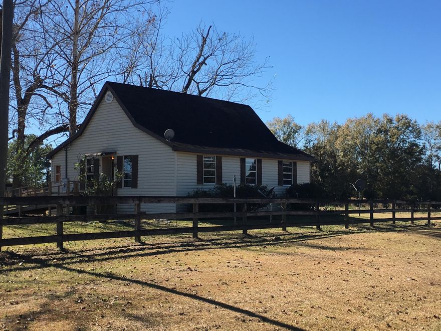 32.5+/- Acres, fenced, cross fenced for horses or cattle. Property fronts Laramore Rd (paved), Medlock and Whitfield Rds (dirt). The property comes with 3 barns/shop/storage and a rustic 2 Br/1B home. Home was made to accompany wheel chair but can be remodeled back if desired. Also included is a 1987 2br/2b mobile home that has it's own septic but pulls water from the resident well. This property is ready for livestock! Loaded with huge pecan trees