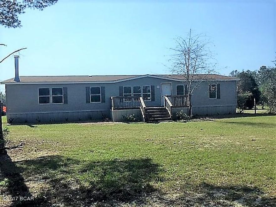 Nice 10 acre tract of wooded land in the country  There is a manufactured home on the property that needs to be repaired or removed.  It has great potential, however.  There is a frmal living room, formal dining room, den with fireplace and large kitchen.  the location is very convenient with easy access to Hwy 231 that south leads to Panama City on the coast where you have some of the worlds most beautiful beaches.  There is an international airport only a few miles away.  From Hwy 231 north you have an easy route up to Dothan, Alabama.