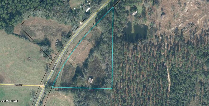 Nice 4 Acres of land. About 1/3 is cleared and rest is wooded. Has a 30X30 older barn. Great spot for a new home. No restrictions. Lots of privacy.  Approximately 800+ feet  frontage on paved highway. Short distance to the Alabama State line. Check it out today.