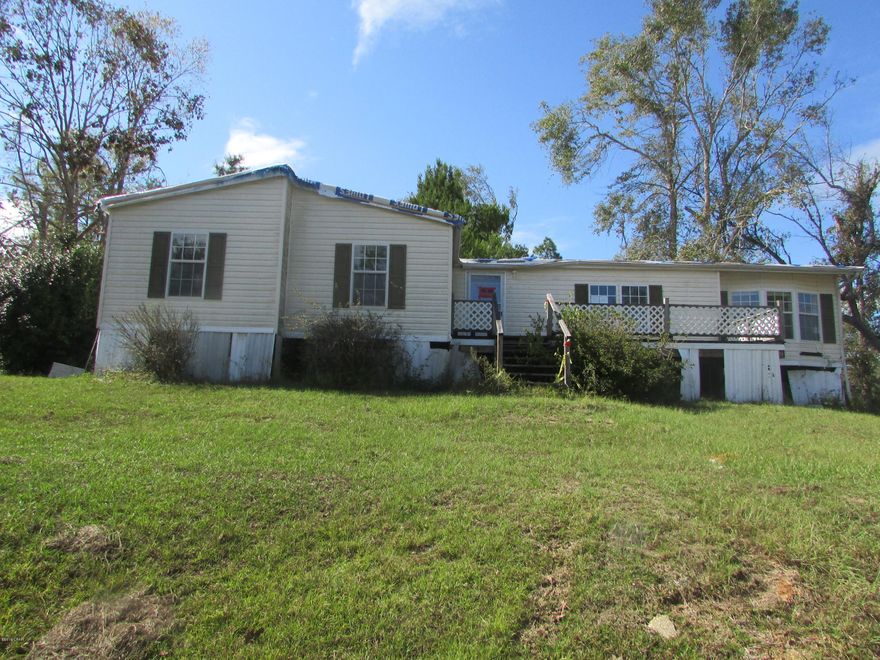 PERFECT location for your new Home!! Located just off Hwy 167 sits this 10 acre parcel that is high and dry! Property has well, septic and electric. There is a MH on the property that has **NO VALUE** it is uninhabitable. The value is in the land! This property will not last long so call today!!