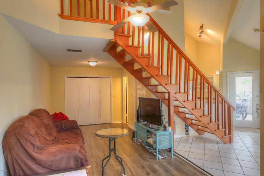 Wow, what a great 1 Bedroom 2 Bath unit in a fourplex on the canal secluded away in Mack Bayou. NO HOA FEE. You will enjoy and appreciate this renovated town house. High ceilings make this small unit very livable. New hardwood floor in living room, custom renovated cabinets in kitchen, full bath and secluded patio area on first level w/Master bedroom and full bathroom upstairs. New hardwood floor in master bedroom. All appliances in kitchen as well as washer and dryer stay with the unit. This unit is very private as it occupies one full side of the fourplex building - giving you own yard to enjoy as well. LOCATION. Close to Sacred Heart Hospital, Grand Boulevard, Baytown, Silver Sands Outlet, Restaurants, Entertainment, Grocery, Banks, and the Beach! Perfect place for anyone!