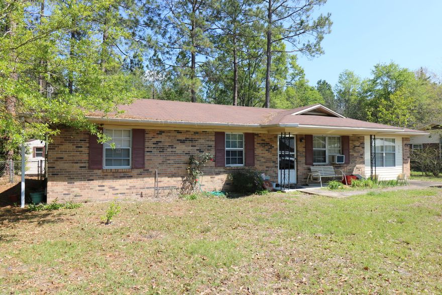 Great location! In the city but at the end of the street for privacy. Features include all brick home, paved driveway, newer roof, French doors, lots of storage space, and an eat-in kitchen. You will appreciate the large living room and abundance of kitchen cabinets. The completely chain link fenced back yard has a double gate entrance on one side. Average electric bill is only $70! Great price! Located about 4 miles from Falling Waters State Park which has the tallest waterfall in Florida. Within 53 miles to the International Airport and the ''World's most beautiful beaches'' of Panama City Beach.