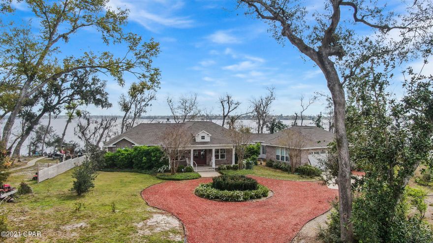 ENJOY SPECTACULAR VIEWS FROM THIS LOVELY HOME ON DEER POINT LAKE THE MOMENT YOU OPEN THE DOOR! WATCH THE SUN RISE AND SET OVER THE LAKE FROM NEARLY EVERY ROOM IN THE HOUSE.. INTERIOR FEATURES INCLUDE  ELEGANT FOYER WITH CROWN MOLDING  THAT LEADS TO THE FORMAL SITTING ROOM. IT OFFERS AN ABUNDANCE OF NATURAL LIGHT, HARDWOOD FLOORS AND FLOWS  TO THE FOYER OR FORMAL DINING ROOM .FROM THERE,YOU WILL FIND THE LARGE BRIGHT  KITCHEN WITH WALK IN PANTRY,BREAKFAST AREA AND BREAKFAST BAR.  THE LIVING  ROOM IS OVERSIZED , HAS HARDWOOD FLOORS, FIREPLACE. AND SCREENED PORCH  ACCESS.  THE MASTER BEDROOM SUITE HAS A GARDEN TUB, WALK IN CLOSET AND A  PRIVATE SCREENED PORCH.  FROM THE KITCHEN YOU ENTER A BREEZEWAY THAT TAKES YOU TO A LARGE GUEST ROOM WITH MINI FRIDGE AND SINK  FINALLY, YOU WILL FIND THE BEDROOM WHICH IS CURRENTLY BEING USED AS AN ART STUDIO. EXTERIOR FEATURES INCLUDE PRIVATE ROAD WITH 8 HOUSES, BRICK EXTERIOR, 2 SCREENED PORCHES AND OVERSIZED WATERFRONT LOT.  CALL TODAY TO SCHEDULE YOUR OWN PRIVATE SHOWING APPT.