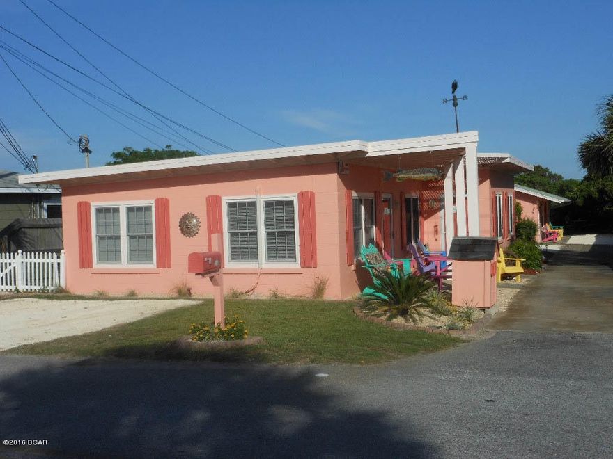 Think Pink Cottages within 200 feet of Gulf! Two classic 1950's duplex cottages; One duplex has two one-bedroom units and the other duplex has a one-bedroom and a two-bedroom unit.  Cottages feature a wonderful view of the Gulf and has been completely remodeled with whitewashed furniture and pretty white kitchens. The back yards of each building are fenced and, in addition, there is another fenced area at the end of the drive way for a picnic area under the pergola.  Located on the quiet West end of Panama City Beach in a residential neighborhood away from all the hustle bustle and carnival type atmosphere. Escape to a time when life was more simple. Family-type restaurants, a donut shop and a hometown grocery stock with the best wine cellar at Panama City Beach are just a short walk away.