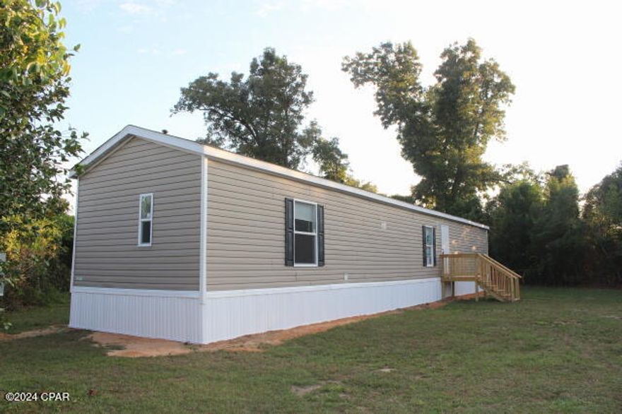 Attention Buyers!  At full price Seller will contribute up to $6,000. towards your closing costs and or pre paids for this Charming Home in Altha. Nestled within the town limits of Altha, this well-maintained property offers a perfect blend of comfort and convenience. With a split bedroom floor plan, this home is currently leased, making it an ideal investment or a chance to make it your own. Enjoy the peace of a small town with access to great schools and essential amenities, including a grocery store and Ace Hardware. Just 15 minutes from Blountstown, where a state-of-the-art hospital is under construction, and less than 20 minutes to Walmart and a variety of restaurants. The property is surrounded by a thick tree line for added privacy, featuring a cozy covered deck at the back—perfect for relaxing in the outdoors. Don't miss this opportunity!