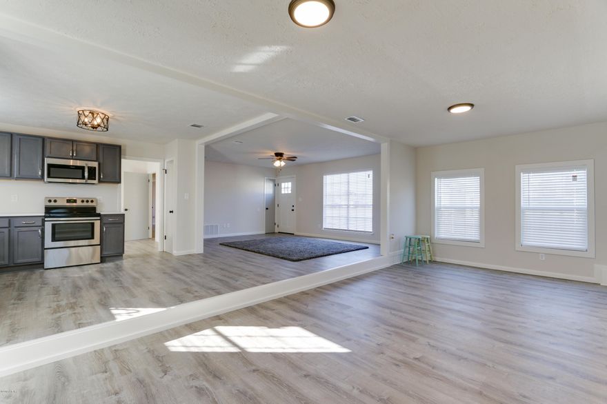 NEW NEW NEW! Beautifully renovated 4 bedroom Beach house on spacious corner lot. Very Open plan with large area for dining and entertainment.  Huge permitted renovation just completed by a licensed Contractor.  All New Kitchen with Stainless Steel appliances, Quartz countertops, Custom Cabinets and Hardware. New Carrier HVAC, New Water Heater, New Lifelock Flooring, New Electrical fixtures and Ceiling Fans, New Paint inside and out, New exterior doors, New custom blinds, New door hardware, New tile floor in master bathroom, New siding in front, New siding in rear, and much more. His & hers closets with updated bathroom & walk-in shower. Home situated on nice sized lot, with ample RV parking & room for garage, shed, or pool.  Short 10 minute walk to Beach!  Golf cart friendly.