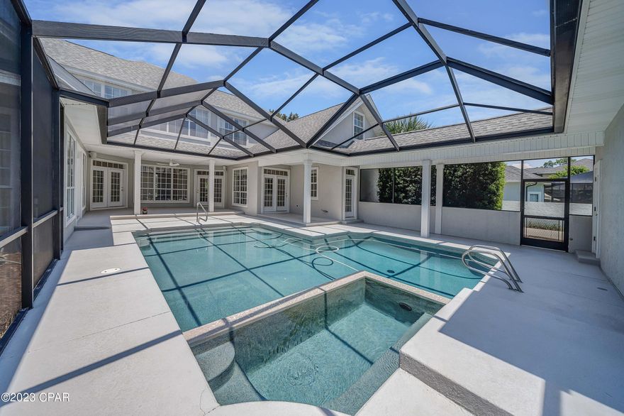 Are you ready to move in?!  This beautiful home in the gated community of Preserve on the Bay is ready for you!  THREE CAR GARAGE, gorgeous backyard with screened in pool, 4 bedrooms, 3 full baths, and 2 half baths!  Enjoy a first floor master suite that opens to the pool, and has double vanities, double closets and a huge walk in shower.  Also on the main floor is family room, dining room, laundry, a pool bath, a half bath, and 2 offices.  If you don't need 2 offices, this would also make a great spot for a craft room, playroom, music room, or an additional first floor bedroom.  Upstairs you have 2 bedrooms, each with private bath, and one of the bedrooms leads to another room that could be used as a bedroom.  Upstairs is also the perfect loft area for a 2nd story living room, or media room.  Your backyard has lovely flowers and trees, an impressive setting to relax in the pool and enjoy the view.  Your screened in pool deck is huge with plenty of room for outdoor cooking, living and dining.  3 car garage and lots of driveway space for cars.  Set on a cul-de-sac street for privacy, you are close to shopping, dining, and the sugar white sandy beaches of Panama City Beach.  Call today to see this great Preserve on the Bay home!