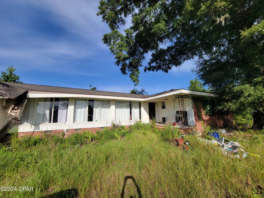 Investor Alert!!
This expansive property presents an exciting opportunity in the heart of Marianna, Florida. Nestled on 5.83 acres, this fixer-upper is ideally located near the Florida Caverns, the Mere, newly constructed K-8 school and high school, making it a prime location for potential development or renovation.

Whether you're looking to restore this charming 3 bed, 2.5 bathroom home or capitalize on the booming Marianna real estate market, this property offers endless possibilities. Don't miss your chance to transform this diamond in the rough into a lucrative investment or dream home. Call today to schedule a viewing and explore the possibilities!

The large shed in back does not convey with the property but will sell separately.