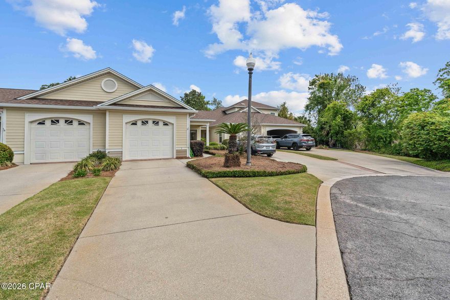 The Oaks Plantation is an exclusive gated community of just 30 townhomes, beautifully landscaped, professionally maintained and perfectly situated near Pretty Bayou and Historic St. Andrews.  
This single-story home is two bedrooms and two bathrooms and features a covered front porch, grand entry, nine-foot ceilings, crown molding, and ceramic tile in the entry, kitchen, laundry, and baths. The kitchen includes GE and Whirlpool appliances. The living area has a tray ceiling and opens to a private screened patio overlooking a picturesque pond and wooded area.
The primary bedroom includes an adjoining sitting room, two closets, full bathroom with double vanities and direct access to the screened porch.  There is ample parking including a single-car attached garage, driveway spots plus an additional dedicated parking spot for this property. 
This property is low maintenance, and the HOA covers the exterior maintenance, insurance, landscaping, gate, and termite bond. Don't miss this opportunity!