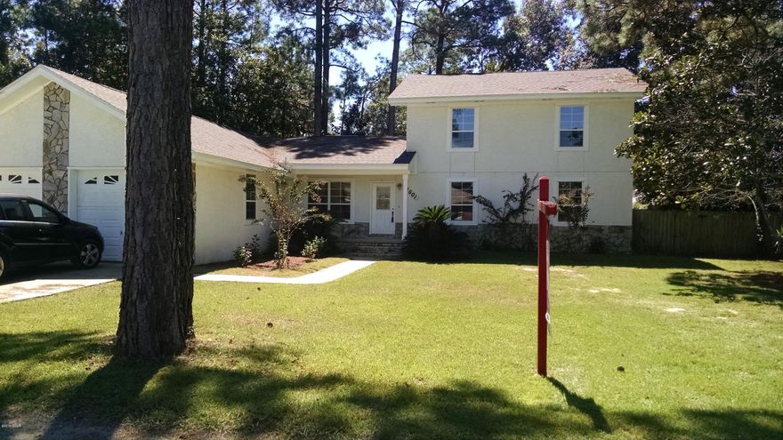 Live in Lynn Haven, feel like you're out in the country! Spacious 4 bedroom and 3.5 bath home on 1/2 acre lot. Nearly 3000 sq ft of living area with super sized rooms through out. Enjoy the two living areas and spacious bedrooms on each floor. Home has been completely renovated and is move-in ready.New roof and new water heater. Fireplace is gas and stove could be easily converted to gas also. Two HVAC systems, one for each floor. Large back yard is fenced and offers to open decks. Survey available. Call to view today!