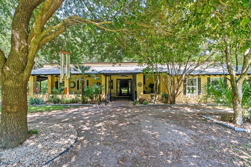 MULTIPLE OFFERS - BEST OFFERS DUE BY 5:00 PM 06/27/24.  Discover the epitome of privacy and security with this stunning home, featuring Spanish architectural influences, nestled on 14.53 beautiful acres. Enter through a long driveway to find your oasis, complete with a solar-powered security gate that you can conveniently control from the house.

The entire property is fenced and cross-fenced, primarily pastureland, making it ideal for equestrian enthusiasts. The 5-stall, 40' x 60' horse barn offers ample space for your horses. Additionally, a 32' x 32' Quonset hut workshop provides a perfect space for projects and storage, featuring a lean-to for covered storage of your farm equipment. A 20' x 22' detached two-car carport offers convenient parking, with a charming bridge leading directly to the home, adding a unique touch of elegance and practicality.

Inside, the open-concept living area is spacious and inviting, featuring a cozy fireplace in the family room. The master bedroom creates a relaxing atmosphere with an en-suite featuring dual showers, a double vanity, and two walk-in closets. It leads through a mud room to a relaxing hot tub on an open patio, creating a warm and intimate retreat. The dream kitchen is a chef's delight, featuring plenty of counter space, granite countertops, and a gas stove, perfect for creating culinary masterpieces.  All windows throughout the home have been replaced with low E double-hung windows, ensuring energy efficiency and come with a lifetime warranty..  

The roof of the home has been meticulously reinforced with steel beams and cross beams, featuring industrial metal in one seamless length and coated  with Gayco (lifetime silicone). The traditional terra cotta tiles have been replaced with durable metal roofing.

This property features two wells and two septic tanks, ensuring ample water supply and waste management for the household and agricultural needs. Additionally, a relaxing hot tub provides the perfect spot to unwind and enjoy the serene surroundings.

The property has been professionally surveyed and freshly painted both inside and out, showcasing its well-maintained condition. Experience the perfect blend of beauty, function, and style in this exceptional home.