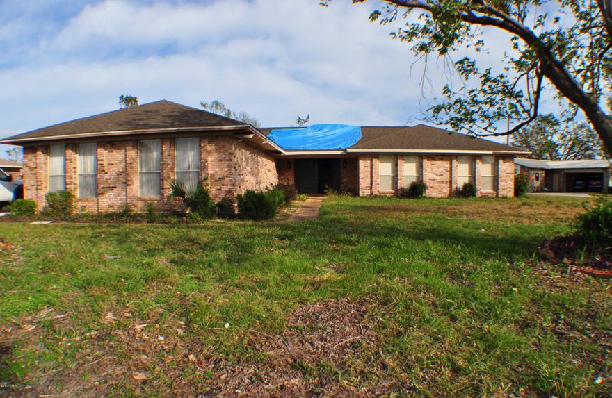 Fantastic waterfront opportunity!  This  4BR/2.5 Northshore home is canal front, has an in-ground pool and over 3,000 sqft of living space.  The canal leads to St. Andrew Bay and the Gulf of Mexico.   The home, pool and boat dock suffered some hurricane damage and is being sold AS-IS.   Interior features include cathedral beamed ceilings, some wood laminate flooring, a bonus living/rec area and a large storage space inside.  The dock will need repairs but the boat lift is still in place.  This home and the neighborhood is quiet and family-friendly and you're merely minutes from shopping, medical facilities, schools and more.  All info is approx. and must be verified by Buyers if important. There is plenty of pantry and closet space throughout the home and there is a large storage room/workshop as well. In addition, the two full baths have skylights, there is some wood laminate flooring, and a generator.  All info is approx and must be verified by Buyers if important.