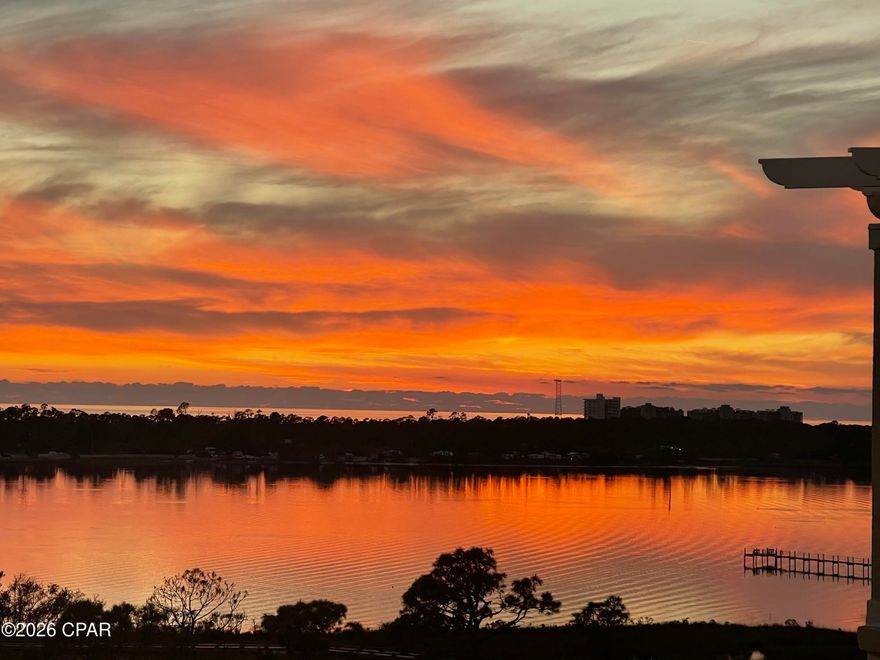 LOCATION, LIFESTYLE, AMENITIES All with stunning WATERVIEWS at The Grand Residence at Bay Point! This rare 2-bedroom, 2-bath, with office/bedroom Penthouse on the 8th floor comes with a deeded garage parking space and climate-controlled storage area. The 1512 sq ft unit features custom cabinets in the kitchen perfect for a chef's tools and storage, ceramic tile flooring, granite countertops, stainless steel kitchen appliances. This unit has 10-foot ceilings throughout, crown molding, modern lighting, updated ensuite bathroom, dual vanities and 2 walk-in closets for his and hers or linen storage. The living room and master bedroom has access to an oversized balcony just perfect for morning coffee or evening sunsets watching wildlife, boats pass by, or dolphin play in Grand Lagoon in front of St. Andrews State Park while overlooking the gulf as well as the golfers on the 4th and 5th hole of the Nicklaus course at Bay Point! The 2nd bedroom features custom cabinets perfect for an in-home office, sewing table or crafting. The resort-style amenities are exceptional for any waterfront condo in Panama City Beach. The Grand Residence offers golf cart parking, large heated pool, hot tub, firepit, grilling area, fitness room, Lanai area with pool and ping pong table, an owner's lounge for community and private parties and a pet area for walking. Bay Point is a golf cart friendly, gated community that features, a newly built Point South Marina with slips for vessels up to 120 feet, 18-hole Nicklaus designed golf course, restaurant with weekly entertainment, tennis courts and 24-hour security.  The location of this unique coastal community is ideal for a primary residence or second home investment as it is located just minutes from toes in the sand on the beach, shopping, waterfront dining and entertainment in Panama City Beach. Schedule your showing today and see for yourself! All information deemed reliable but not guaranteed. Buyer to verify all measurements and details.