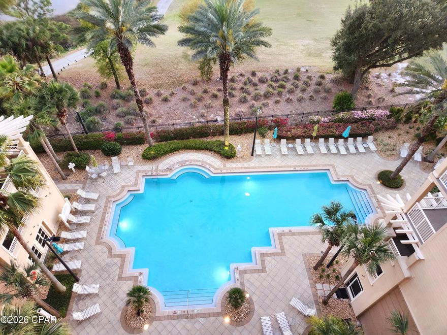 LOCATION, LIFESTYLE, AMENITIES All with stunning WATERVIEWS at The Grand Residence at Bay Point! This rare 2-bedroom, 2-bath, with office/bedroom Penthouse on the 8th floor comes with a deeded garage parking space and climate-controlled storage area. The 1512 sq ft unit features custom cabinets in the kitchen perfect for a chef's tools and storage, ceramic tile flooring, granite countertops, stainless steel kitchen appliances. This unit has 10-foot ceilings throughout, crown molding, modern lighting, updated ensuite bathroom, dual vanities and 2 walk-in closets for his and hers or linen storage. The living room and master bedroom has access to an oversized balcony just perfect for morning coffee or evening sunsets watching wildlife, boats pass by, or dolphin play in Grand Lagoon in front of St. Andrews State Park while overlooking the gulf as well as the golfers on the 4th and 5th hole of the Nicklaus course at Bay Point! The 2nd bedroom features custom cabinets perfect for an in-home office, sewing table or crafting. The resort-style amenities are exceptional for any waterfront condo in Panama City Beach. The Grand Residence offers golf cart parking, large heated pool, hot tub, firepit, grilling area, fitness room, Lanai area with pool and ping pong table, an owner's lounge for community and private parties and a pet area for walking. Bay Point is a golf cart friendly, gated community that features, a newly built Point South Marina with slips for vessels up to 120 feet, 18-hole Nicklaus designed golf course, restaurant with weekly entertainment, tennis courts and 24-hour security.  The location of this unique coastal community is ideal for a primary residence or second home investment as it is located just minutes from toes in the sand on the beach, shopping, waterfront dining and entertainment in Panama City Beach. Schedule your showing today and see for yourself! All information deemed reliable but not guaranteed. Buyer to verify all measurements and details.