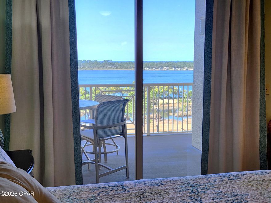 LOCATION, LIFESTYLE, AMENITIES All with stunning WATERVIEWS at The Grand Residence at Bay Point! This rare 2-bedroom, 2-bath, with office/bedroom Penthouse on the 8th floor comes with a deeded garage parking space and climate-controlled storage area. The 1512 sq ft unit features custom cabinets in the kitchen perfect for a chef's tools and storage, ceramic tile flooring, granite countertops, stainless steel kitchen appliances. This unit has 10-foot ceilings throughout, crown molding, modern lighting, updated ensuite bathroom, dual vanities and 2 walk-in closets for his and hers or linen storage. The living room and master bedroom has access to an oversized balcony just perfect for morning coffee or evening sunsets watching wildlife, boats pass by, or dolphin play in Grand Lagoon in front of St. Andrews State Park while overlooking the gulf as well as the golfers on the 4th and 5th hole of the Nicklaus course at Bay Point! The 2nd bedroom features custom cabinets perfect for an in-home office, sewing table or crafting. The resort-style amenities are exceptional for any waterfront condo in Panama City Beach. The Grand Residence offers golf cart parking, large heated pool, hot tub, firepit, grilling area, fitness room, Lanai area with pool and ping pong table, an owner's lounge for community and private parties and a pet area for walking. Bay Point is a golf cart friendly, gated community that features, a newly built Point South Marina with slips for vessels up to 120 feet, 18-hole Nicklaus designed golf course, restaurant with weekly entertainment, tennis courts and 24-hour security.  The location of this unique coastal community is ideal for a primary residence or second home investment as it is located just minutes from toes in the sand on the beach, shopping, waterfront dining and entertainment in Panama City Beach. Schedule your showing today and see for yourself! All information deemed reliable but not guaranteed. Buyer to verify all measurements and details.