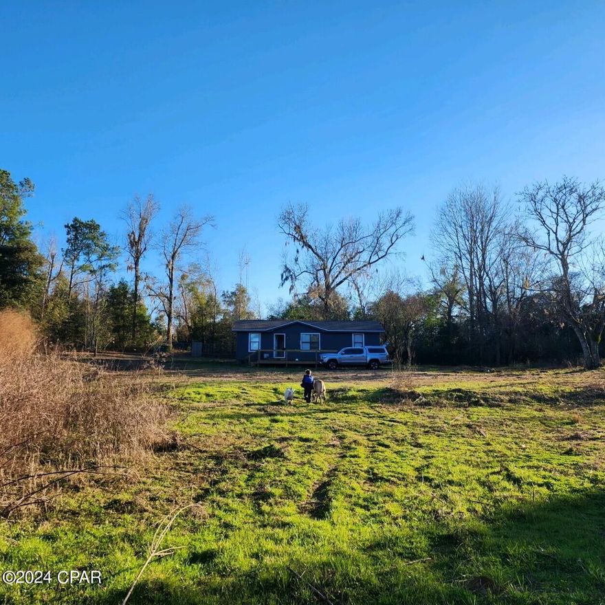 38 acres in Cottondale City limits with three bedroom/2 bath home.  Has a large front deck, lots of beautiful trees.  Great location for a small farm with city water to property.  Call for more information.