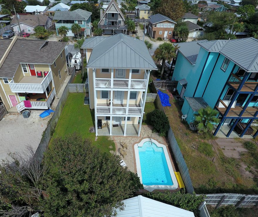 You need to discover the gorgeous views of the Gulf from this 3 story beach house. This home has the finest amenities including 10'ceilings accented by crown molding, ceramic tiled and hardwood floors, solid surface counter tops, all new stainless appliances and new heating and cooling heat pump installed in 2018, Hurricane resistant impact windows, all this topped off with lovely in-ground pool. Each bedroom has a private bath, walk-in closets and two bedrooms have balconies. The top floor is great as a rec room and includes a wet bar, half bath and it too has a private balcony. Not only is the beach just a short stroll away, but you're also convenient to several marinas and boat ramps, shopping, restaurants, etc. Furnishings are optional, call today for appointment!