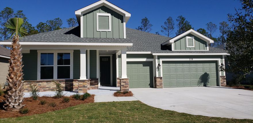 Tracewood - Carolina elevation. Samuel Taylor built home that features the Tracewood floor plan, 2516 sqft 3-Car Garage. All homes are currently built above hurricane code with 2'x6' exterior wall framing, hurricane tie down rod and anchor system, architectural shingles and higher insulation ratings. Interior standard features include 9 and 10 foot ceilings, tile and carpeted floors, granite counter tops, gas stove, microwave, dishwasher and garbage disposal. Upgrade options are available. Please visit the Model home located at 206 Basin Bayou Drive for more information! Excellent opportunity to be in the hottest community on the Beach. WALK TO SCHOOL!