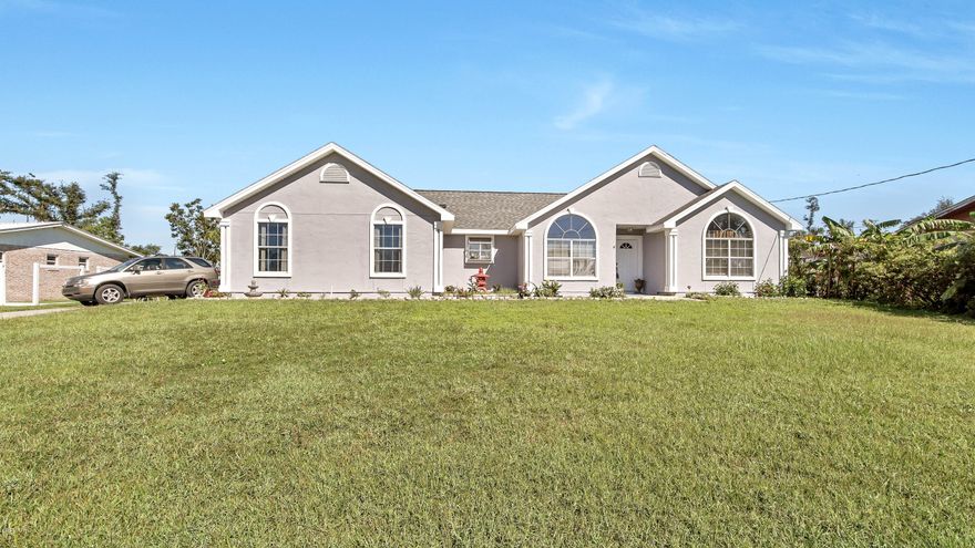 A beautiful home with a great location at the  entrance to Donalson Point and less than 4 miles to Tyndall AFB. The home has had many new upgrades that include new roof, new flooring, fresh paint job inside and out.  Very spacious comfortable living room area with fireplace. Bright kitchen and wrapped bar counter with lots of room for the family gatherings. There is a  separate dining room as well. From the large master bedroom  you enter the en suite master bathroom which boasts a garden tub and separate walk in shower, as well as large walk in closet. The square footage of the home is laid out very well. The 2nd and 3rd bedrooms are nice sizes as well. The two car garage is entered on the side and has painted floors. The lot is unusually  wide as well as deep and high off the street.