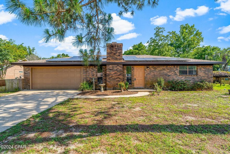 CURRENTLY UNDER CONTRACT, SELLER WILL CONSIDER BACKUP OFFERS: This nicely renovated residence offers the perfect blend of comfort and convenience, with easy access to everything Panama City Beach has to offer. Located just a short distance from Pier Park's bustling shopping and dining scene, as well as the county pier and pristine beaches, this home boasts an enviable location - everything you need is just moments away. Step inside to discover a spacious family room, complete with a cozy fireplace perfect for gatherings. The fully equipped kitchen and adjoining dining area provide the ideal space for preparing and enjoying meals together. Two generously sized bedrooms await, each featuring its own walk-in closet for ample storage. The master bedroom boasts an en suite bathroom, while a second guest bathroom ensures comfort and convenience for all. Additional highlights of this home include a large Florida room, offering the perfect spot to relax and unwind, as well as a double garage and exterior storage building for added convenience. With a total of 1,505 square feet of heated and cooled space, 1,338 square feet of living space, along with a separate workshop/laundry room spanning 167 square feet, this home offers plenty of room to spread out. We appreciate your interest in this home!