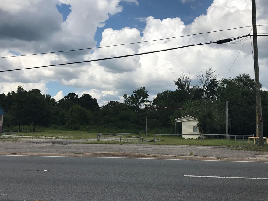 Nice 1.26 Acre Commercial lot with 100 Feet of Highway 90 Frontage.  This lot is ideal with a large flat building area, located in the thick of town with high traffic counts and a curb cut entrance already in place. This property consists of three parcels totaling approximately 55,000+ Sq Ft., with its western border adjoining Hardee's Restaurant in Marianna, FL. There is a small office building on site.  Parcels are currently zoned commercial and are located in the county with water, sewer and gas available at the road.  Drive by today and see all this property has to offer!