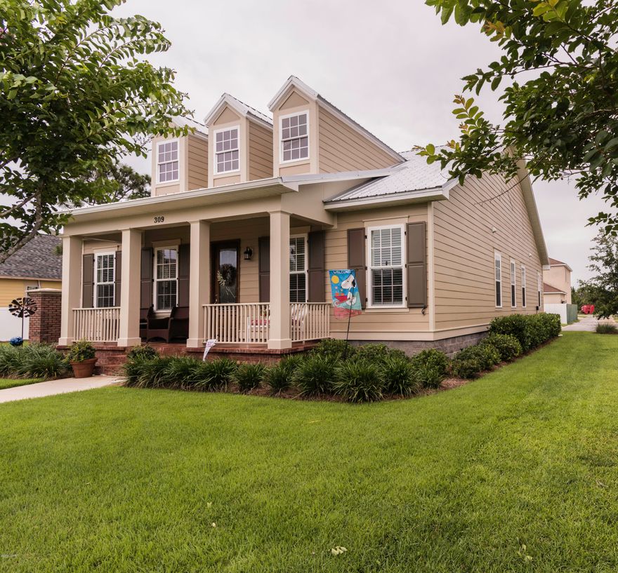 Stunning custom built home in one of Panama City Beach's most centrally located neighborhoods!As you walk in you immediately notice the amazing wood-look plank tile flooring and open plan.This home boasts many upgrades such as custom lighting,crown molding,rare granite,subway tile back splash,stainless steel appliances,double convection oven/microwave,stained concrete floors on patios,gas fireplace and so much more.Every detail was thought out and fine tuned.The kitchen is an entertainers dream with plenty of cabinet and counter space.All four bedrooms are good size with ample closet space.You'll enjoy the warm nights outside on the screened-in patio overlooking your nice lush green private back yard.Two car garage plus! Only a short golf cart ride to the beach