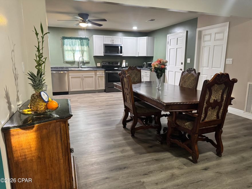 Completely renovated, built Architectural Ranch-Style design home, this exceptional property at 1021 8th Avenue offers space, quality, and value rarely found in Graceville. The home features 3,075 total square feet, with 2,023 square feet heated and cooled, and sits on a spacious 1.19-acre lot. Inside, the thoughtfully designed single-level layout offers a bright, open flow enhanced by fresh finishes throughout, updated flooring, modern fixtures, and a neutral color palette that complements any style. The kitchen is both functional and inviting with ample cabinetry, generous counter space, and an excellent layout for entertaining. Expansive living and dining areas create ideal spaces for hosting or everyday living.

The primary suite serves as a private retreat, complete with a nicely updated en-suite bath, while additional bedrooms are well-sized and versatile for guests, family, or a home office. Bathrooms have been tastefully renovated with clean, contemporary finishes.

Outside, enjoy the freedom and flexibility of over an acre of land, perfect for outdoor entertaining, recreation, gardening, or future enhancements. The property's curb appeal and setting reflect pride of ownership and offer room to grow.

Conveniently located near schools, shopping, and local amenities, this home combines charm with the comfort and sophistication of Architectural Ranch-Style living.

Homes offering this level of renovation, acreage, and square footage are rare — schedule your private showing today.