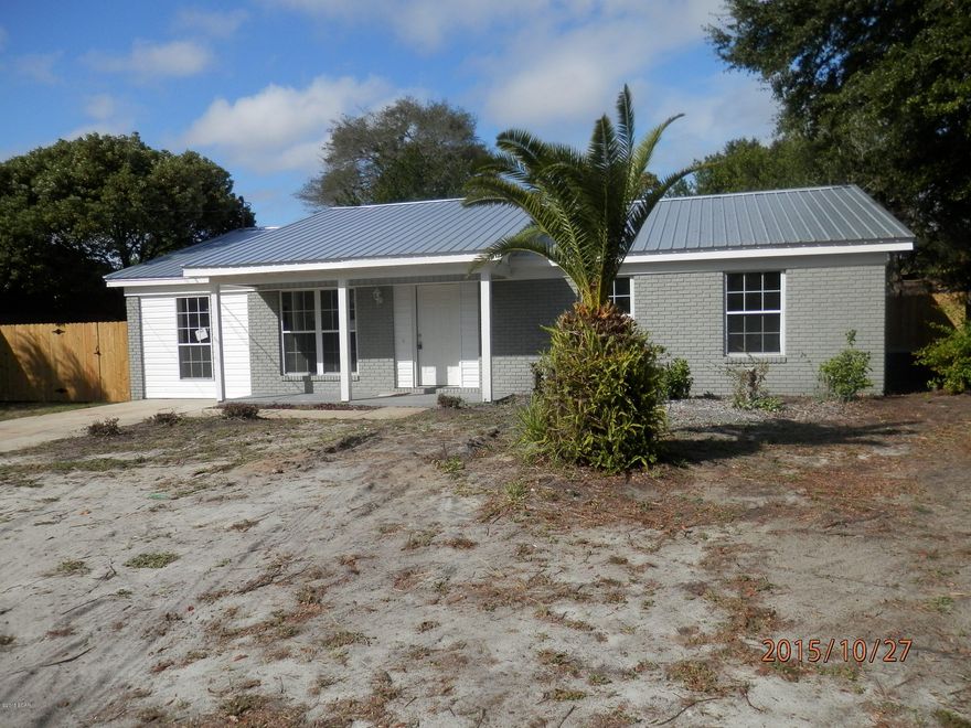 Newly renovated home with new metal roof, freshly painted interior and exterior. New carpet and vinyl flooring. Kitchen has new cabinets and counter tops as well as vinyl flooring. Master bedroom with private bath and his and hers closets. Nice privacy fenced back yard.