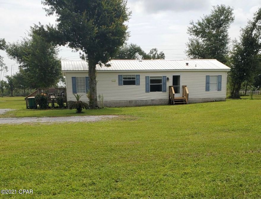 CURRENTLY UNDER CONTRACT, SELLER ACCEPTING BACKUP OFFERS!! 

Looking for a mini farm close to town, here it is, Over 6 acres, with a fishing pond, pole barn with slab floor, storage container and a great yard for the kids or pets to play. This spacious  Doublewide features new appliances including washer and dryer, large bedrooms and a large new bonus room with gas fireplace and storage closet. Hunt and fish on your own property. Please verify measurements if important. Call your realtor and go see this home.