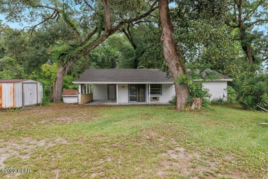 'CURRENTLY UNDER CONTRACT, SELLER WILL CONSIDER BACKUP OFFERS' Without a doubt, this home is one of the most charming properties and best opportunities available on the market. This 2 bedroom, located just 3-4 minutes from the airport and less than 15 minutes from Back Beach Rd, is situated only 6 miles to both Hwy 79 and Hwy 77.

With original hardwood floors throughout, spacious rooms, and a beautiful 1/3 acre lot, the possibilities for this charming home are endless. Grab your tools and paint brushes and come turn this into the perfect home or 2nd home/investment property!