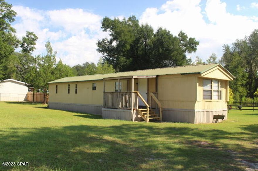 This affordable home is perfect for those who are ready to downsize.  Can be your primary or purchase as rental income.  Or if you are looking for a winter home in Florida. Your second getaway home. This is one to take a look at.  Split bedroom floor plan. Nice size completely fenced yard.  Metal roof, central heat & air. Short drive to Lake Seminole for fishing & boating.