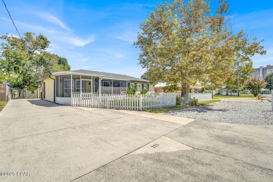 Beachside Living - No HOA & Just Minutes to the Shore!
This move-in-ready Panama City Beach home sits only four blocks from the sand and features a charming gated white picket fence out front. Located on the popular west end, the golf cart-friendly neighborhood makes getting to the beach a breeze and provides quick access to Pier Park, Frank Brown Park's pools and sports facilities, and Dolly Parton's Pirates Voyage Dinner Theater and McGuire's Irish Pub.
Inside, you'll find recent updates such as upgraded kitchen cabinets with new counter tops and backsplash, plus a spacious master suite addition with a jetted soaking tub and walk-in shower. A tiled, screened Florida room adds year-round comfort, while the backyard includes a newly built oversized two-car garage/workshop with epoxy-style Ninja flooring, a separate ''she shed,'' and a concrete drive with RV parking (raised wiring for tall RV's). A covered back porch offers the perfect spot to relax outdoors. 
Additional features include fresh interior and exterior paint, spray foam insulation, double crown molding, new motion-sensor security lighting, irrigation system, privacy fence, off street and driveway parking, and an electric dog fence! The roof is just five years old, and the HVAC Is 5 years old as well and is under a maintenance contract. The appliances are newer—all included along with washer/dryer and three mounted TVs. Property survey available. All measurements are approx. and should be verified by the buyer.