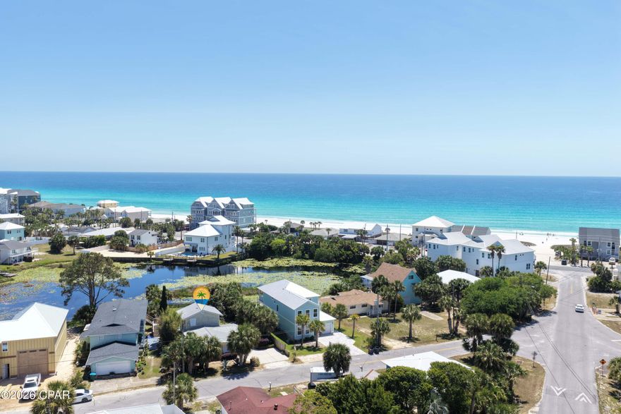 Location, Location, Location!!!  Enjoy the best of coastal living with this beautiful lakefront home in Laguna Beach, where you can enjoy the lake - and you are also just a short walk to the sugar-white sands of Panama City Beach! Take the quick, easy stroll to Beach Walkover #84 for a beach day in the sun, or view of the evening sunset.  Relax on your back patio and take in peaceful lake views - this is the ideal spot for sipping on a beverage and reading a book; or grilling, games and entertaining with friends and family.  This 3-bedroom, 3 full bath home offers the perfect blend of comfort and convenience and is being sold fully furnished and rental-ready.  This desirable beach home is the perfect investment property or personal getaway. Don't miss this rare opportunity to own lakefront living with easy beach access - call today!
