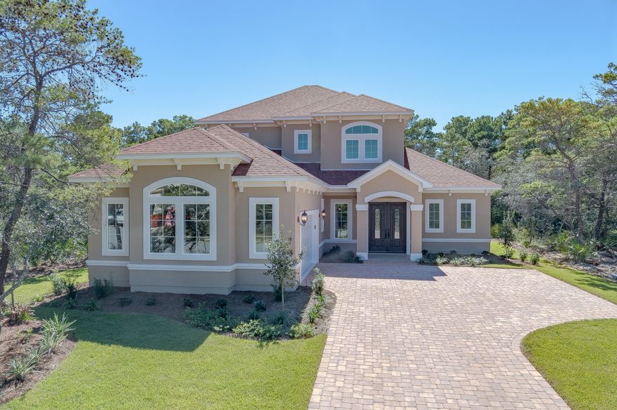 STUNNING newly completed Mediterranean style home, in the beautiful, upscale, gated community of Preserve on the Bay, in the heart of Panama City Beach.  This one of a kind dwelling features 5 bedrooms, 4 1/2 baths, and consists of 2,983 sq. ft of luxury living.  As you enter the double door entryway to the home, you are immediately greeted with quality and class.  Standard features of this home include a separate formal dining room, upgraded hardwood flooring, extensive trim, granite counter tops used throughout, and raised 10 foot ceilings.  For the cooking enthusiast, the large Kitchen features stainless steel natural gas appliances, a walk-in pantry, and an oversized island which incorporates a wine rack.  The Master Suite wing features an oversized bedroom, large walk-in closet, double vanity sink, a soaking garden tub, and a separate tiled glass enclosed shower.  4 out of the 5 bedrooms in this home are en-suite.  This is a highly energy efficient home constructed of 2"x6" framing, double paned low-E windows, natural gas appliances, and a natural gas tankless Rinnai water heater.  The home is backed by a comprehensive builders warranty.  All dimensions are approximate, please measure for accuracy.