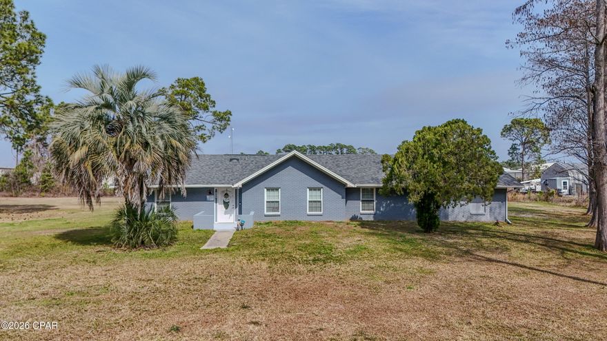 RARE FIND--over an acre in the heart of Panama City Beach, just minutes from our beautiful beaches, local restaurants, boat ramps, the state park, top-rated schools, and the Navy Base--yet offering the privacy and peaceful feel of country living. Truly the best of both worlds.

This spacious 4-bedroom, 3-bath home features a vaulted, oversized family room with a cozy fireplace and an updated kitchen designed for both everyday living and entertaining. Step outside to enjoy two generously sized storage buildings, ideal for hobbies, equipment, or extra workspace. With plenty of room to spread out, there's space for your toys, projects, and outdoor lifestyle--this home truly has room for everyone. Don't miss your chance to own this incredible gem.