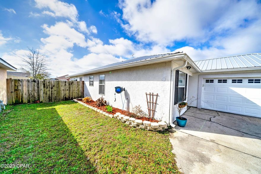 OPEN HOUSES SAT & SUN.!!! GORGEOUS!! Beautifully Renovated, stunning back yard, metal roof, with FLORIDA ROOM, home awaits You!! Enter into a fantastic open living room with LPV, and lots of natural light. The kitchen will delight the Chef in You with it's stainless steel appliances, granite counter tops AND a spacious breakfast bar!! Head through the french doors into an Amazing Florida Room, for your morning cup of coffee, or to relax after a long day. Back yard is perfect for entertaining with the Pergola to sit under. An industial sump pump has been installed, 500 gallons per minute....no issues with storm water!! Location - PERFECT! Close to Tynall AFB, shopping and the GULF!! Call your favorite Realtor to see this one Today!! Measurements to be confirmed by buyer.