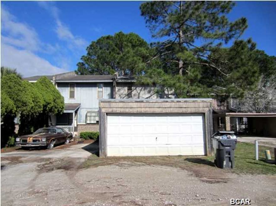 UNBELIEVABLE PRICE FOR A WATERFRONT TOWNHOME WITH A DOCK OVERLOOKING EAST BAY! This three bedroom townhome features a living area, kitchen and half bath on the first floor. The second floor has a Master bedroom with a balcony that overlooks the water. There are two additional bedrooms and full baths on the second floor. The property is deep and has a secured chain-link fence before the water's edge. There is also an attached utility room on the back of the home. In front, there is a detached two-car garage. Home is being sold in its AS IS condition.