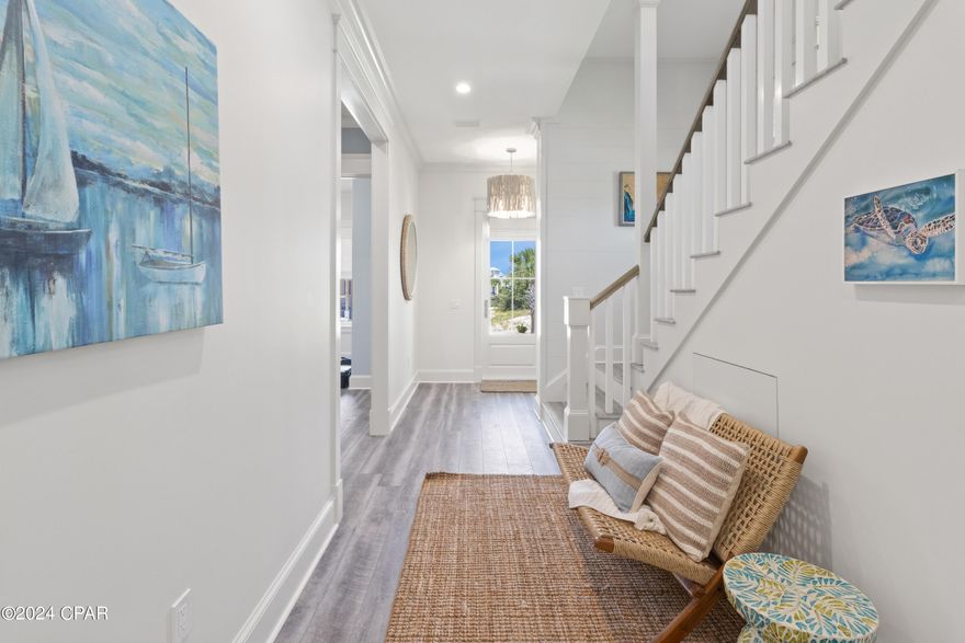 CURRENTLY UNDER CONTRACT, SELLER WILL CONSIDER BACKUP OFFERS. Discover your coastal haven in the prestigious Ovation community on Cape San Blas! This brand-new, multi-level beach house features 4 bedrooms, 3 full baths, and 2 half baths, epitomizing luxurious living in a tranquil beachfront setting. Step into modern sophistication with this newly completed gem, crafted with comfort and style at its core. Every aspect of this custom home showcases meticulous attention to detail, ensuring a lifestyle of unparalleled elegance. The ground floor includes 2 bedrooms and its own private living/dining room, complete with a sink and wine refrigerator, providing an ideal space for hosting guests. The second floor boasts a great open floor plan with a gorgeous custom kitchen and a spacious owner's suite, perfect for both everyday living and entertaining. The third floor is thoughtfully designed with 4 bunks and a private living area, offering a cozy retreat for family and friends. Ovation, a private gated beach community, offers the perfect backdrop for refined coastal living. Relish the charm of this secluded enclave, where privacy and prestige effortlessly intertwine. Enjoy the privilege of residing in a community that prioritizes exclusivity and security. Ovation's amenities enhance your coastal lifestyle beyond the beach retreat. Take advantage of two bayside docks, perfect for boating and kayaking. Challenge friends to a tennis match on immaculate courts or unwind with a swim in the bayfront or gulf side pools. Experience boardwalk access to uncrowded, pet-friendly beaches, where you can soak up the sun, sea, and sand in a serene environment. Don't miss the breathtaking water views from your balcony, enriching your coastal living experience. Seize the opportunity to make this multi-level masterpiece your home, where beachside living and exclusive community amenities create an unparalleled lifestyle. Elevate your living in the lap of coastal luxury at Ovation on Cape San Blas!