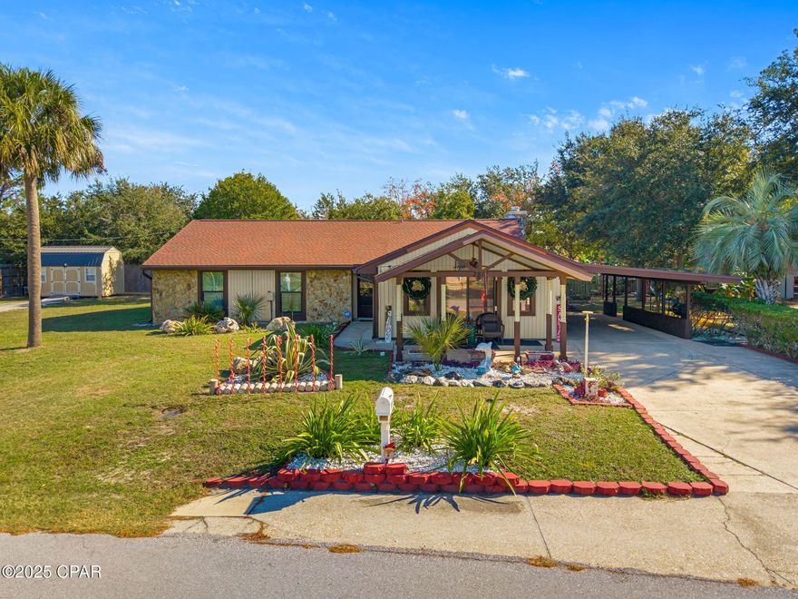 Located just minutes from the beach! This 3 bedroom 2 bath home with enclosed Florida room is complete with a sprawling 0.42 acre double lot and extended deck for your own backyard oasis or short term rental with room for accessory units. Cozy up next to the fireplace in this spacious open floorplan that's perfect for entertaining. The functional kitchen is equipped with solid wood cabinets, newer appliances, and granite countertops. The powered workshop shed provides ample space for projects and storage for your gear. Roof 2019, HVAC 2019, and Water Heater 2018.