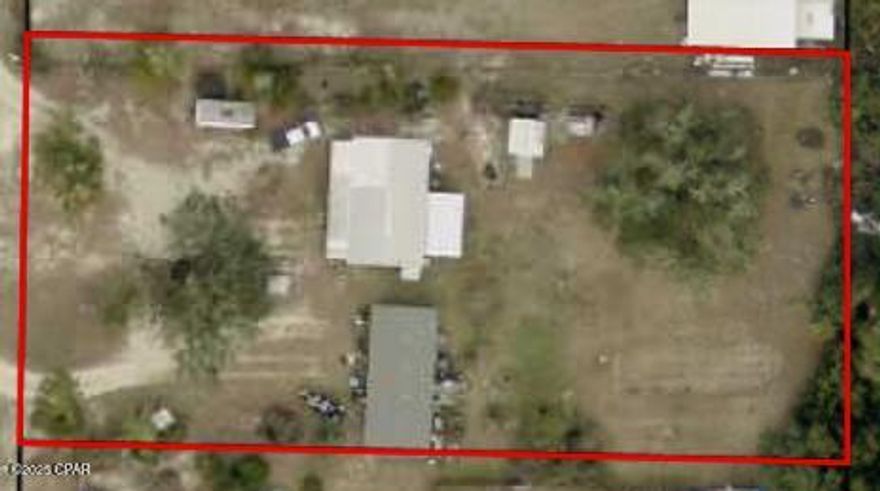 Investment Opportunity on 1 Acre - Two Mobile Homes 9412 and 9408 Pat Rd.
Discover the perfect rural retreat with built-in income potential! This 1-acre property features two mobile homes, offering flexible options to live in one and rent the other, or utilize both as rental income-producing investments.
The property includes a large garden area with irrigation, making it ideal for those who enjoy gardening or sustainable living. It is fenced on both sides, providing privacy and security. Both homes are move-in ready, though some TLC would make them shine even more.
Enjoy the best of both worlds - peaceful country living just 15 minutes from Panama City, 35 minutes to Tyndall AFB, and 45 minutes to the world's most beautiful beaches.
Don't miss this chance to own a versatile property with income potential in a convenient location!

SS appliances in9408 do not convey as they are property of the renters.  There is a replacement stove in the shed.  Property is occupied in 9408 - please give 24 hours notice.