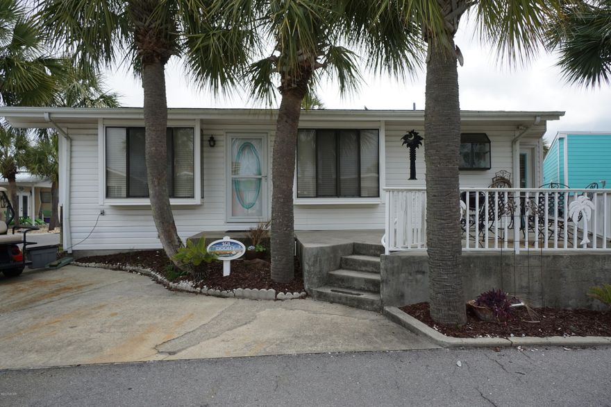 Look at this beauty on a great corner lot! This 3 bedroom, 2 bath home is just waiting for you to make your own. The home is very close to the front of Venture Out resort, making your walk over to the beach a breeze. You will love the large kitchen with breakfast bar and good size living room. This home also features a nice front porch for relaxing after those long days at the beach! It doesn't get better than this! Venture Out is a golf cart community that has 300' on the beautiful pristine beaches of the Gulf of Mexico and 1,000' on the Grand Lagoon. Venture Out has something for everyone. With two salt water pools (one heated), fishing pier, boat ramp, mini golf, children's play ground and much more.