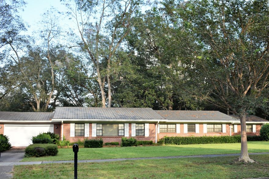 Right in the heart of the City of Chipley is this rare property with it's own pecan orchard in the completely fenced in back yard.  The eat-in kitchen has been completely updated and features all stainless steel appliances.  Big family? No problem - this home has the capability to accomodate your family with it's very own mother-in-law suite with a kitchen and a separate entrance.  Many extras  make this home a very desirable choice to include a metal roof, attached garage, large back porch, workshop, 2 separate driveways, large picture windows overlooking the completely fenced pecan orchard, and.... it is so convenient to everything.