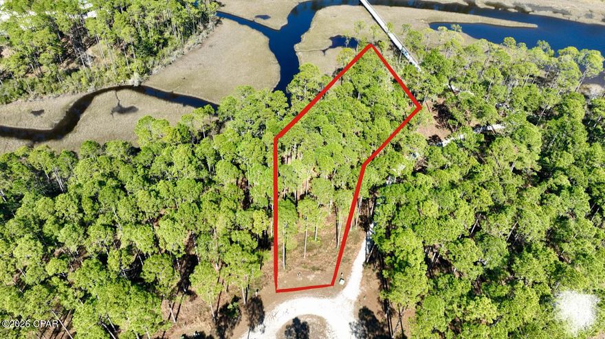SELLER FINANCING AVAILABLE! Build your dream home today on this picturesque cul-de-sac lot available now in the pristine, gated RiverCamps neighborhood! Seller has provided beautiful home plan as well as homesite lot plan! Lot is waterfront to a creek for easy access for a canoe or kayak. RiverCamps is a dream location for the outdoor enthusiast featuring abundant wildlife, miles of wooded walking paths, an expansive boardwalk, breathtaking views, onsite boat parking, and even a private boat launch! RiverCamps offers over 1,000 acres of preserved land nestled between the Intercoastal Waterway, Crooked Creek and West Bay. Just a 5 minute drive to Panama City Beach International Airport, and 15 minutes from the world's most beautiful beaches, shopping, dining and endless entertainment all found in Panama City Beach. Call your favorite agent to check out your future home location today!