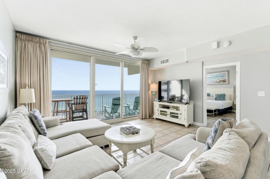 Enjoy stunning gulf views and relaxed coastal living in this 2BR/2BA Shores of Panama condo. This highly popular ''C'' floor plan features floor-to-ceiling windows that fill the space with natural light and open to an extra-wide balcony overlooking the beach and tropical pool. The gulf-front master bedroom has a private ensuite, and the second bedroom plus living area comfortably sleep up to six guests. The bright, modern kitchen offers quartz countertops, white cabinets, a bar counter, and stainless appliances, complemented by tile flooring throughout for easy maintenance. Recent updates include new toilets (March 2025), beds (May 2025), HVAC (July 2025), and stacked washer and dryer (August 2025). The unit comes fully furnished in a relaxed coastal style with one assigned parking spot.

Shores of Panama delivers exceptional resort-style amenities, including a 14,000+ sq. ft. zero-entry lagoon pool, fitness center, heated indoor pool, spa, conference room, tiki bars, hot tubs, grills, snack bar, covered parking, and 24-hour security. Conveniently located near Panama City Beach's top dining, shopping, and entertainment—including Pineapple Willy's just next door—this condo combines modern comfort, coastal charm, and captivating vistas. Reach out today to tour this beautifully updated unit and enjoy life on the Gulf.