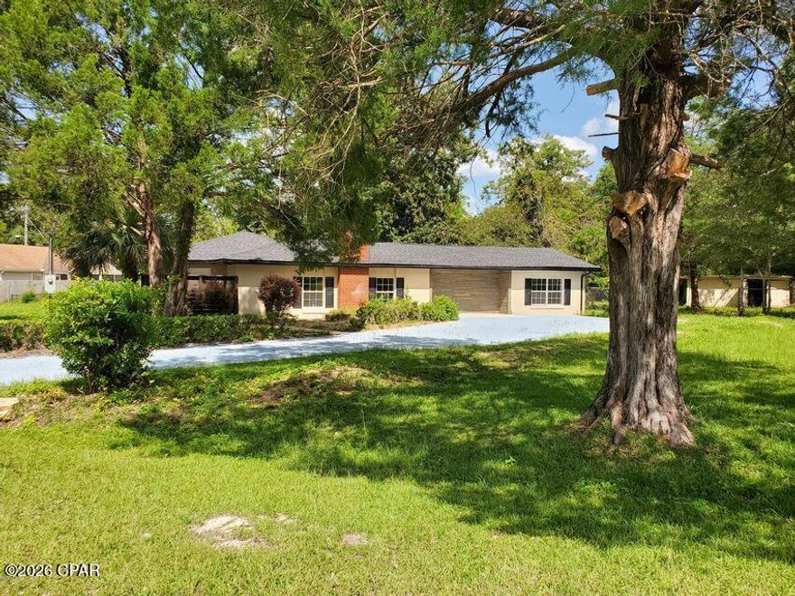 Spacious Home with Immaculate landscape on almost an acre lot. Seller is meticulous about keeping the yard groomed including which includes beautiful spruce trees, large back open deck,
tall standing brick fireplace, large newer yard building/shop all fenced in. 
A 4-bedroom 2 bath home with space, space, space! Kitchen is newly renovated with a large Island a cook's delight! Large living room with fireplace, office, bonus areas and a newly built screened in Florida room out back. Roof, AC, Water heater all newer. Interior features spacious living area with ceramic floor tile throughout the home. The living room features wood grain vinyl floor covering. This home checks all the boxes for a large family or a mother-in-law suite situation. Enjoy fresh country air yet close to all Chipley has to offer literally a street or two away. Come see this home today! Buyer and Buyers agent to verify all dimensions and anything deemed important.