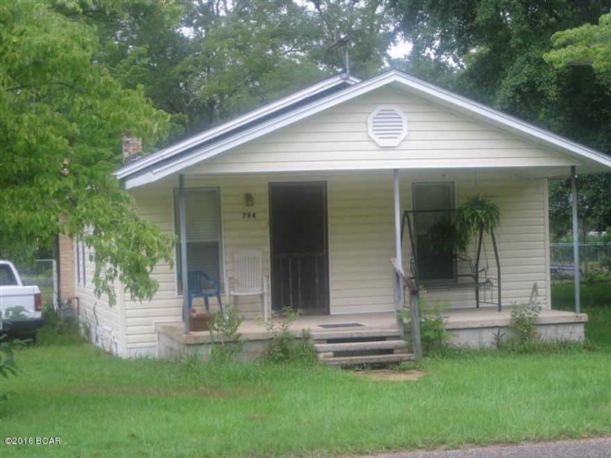 Wood with vinyl siding, Front porch, back screened porch, corner lot, portable storage building, 2 bedroom, 1 bath, house well maintained, kitchen appliances stay with house. Some furniture and washer/dryer available for negotiated price, older appraisal available. Convenient location.