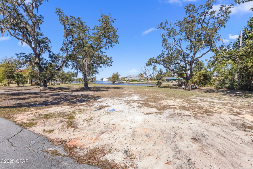 Kings Point on Pretty Bayou next level .458 acre waterfront parcel with access to North Bay and the pass via Pretty Bayou.  Rare opportunity for water front centrally located with city water and sewer.  Views of Pretty Bayou and North Bay are fantastic.