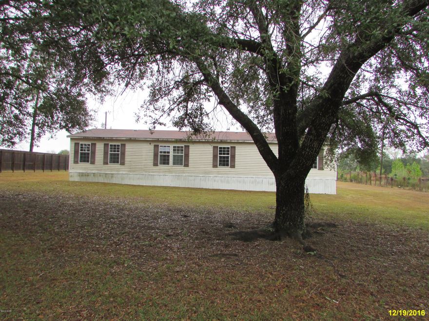 PRICED TO SELL!!  3 Bedroom 2 Bath DWMH with 1792 sq ft sitting on 1 acre! French sliding doors lead to open deck overlooking the in-ground Pool!!!  The kitchen has plenty of room with lots of cabinet space, built in pantry and a center island! The master bedroom has a sitting room or nursery. The bathroom has a separate shower, garden tub and double sinks. The drive to this property is beautiful with the paved tree canopy road. Call today for your personal showing!