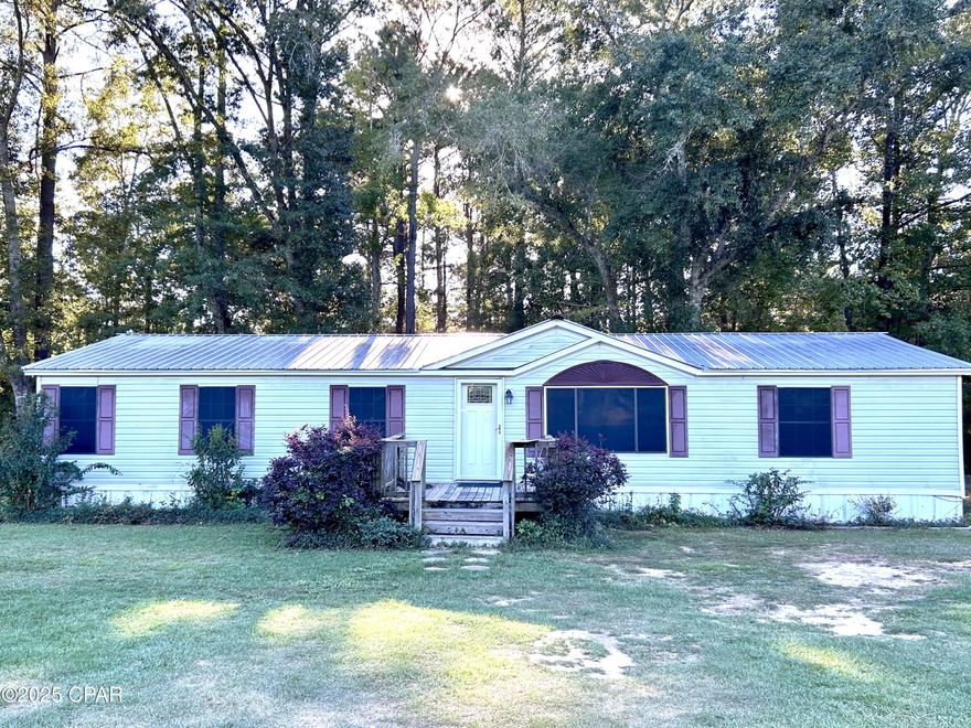 Partially renovated property with potential!  This 2001 double wide manufactured home offers approximately 2,040 sq ft of heated and cooled space (2,104 total), featuring 3 bedrooms and  2 full bathrooms and a covered porch— all set on a private 2.75-acre lot near the end of a quiet road.

The home needs cosmetic work throughout but has great bones and several key updates already in place, including a metal roof replaced in 2018, new dishwasher, and new laminate flooring in much of the home.

Whether you're an investor looking for your next project or a homeowner ready to renovate and build equity, this property offers plenty of space, privacy, and potential. Being sold As Is, it's priced with repairs in mind — bring your vision and make it your own!